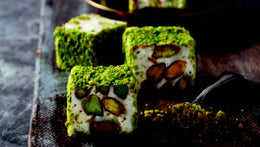 Indulge in the creamy indulgence of Sultan's Premium Turkish Delight - Milk Flavor with Pistachio Covered Powder Pistachio. Each luxurious piece offers a velvety milk flavor complemented by the crunch of pistachios and the smoothness of powdered pistachio coating. Elevate your Ramadan celebrations with this decadent delicacy, meticulously crafted to satisfy your sweet cravings. Order now for delivery in South Florida and across the US.