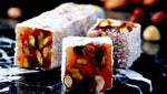 Indulge in the exquisite blend of flavors with Sultan's Premium Turkish Delight - Mix Nuts Covered Coconut. Each delightful piece is adorned with a variety of nuts, including almonds, walnuts, and hazelnuts, all enrobed in a luscious coconut coating. Elevate your Ramadan celebrations with this luxurious treat, perfect for sharing with loved ones. Order now for delivery in South Florida and across the US.