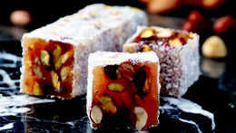Indulge in the exquisite blend of flavors with Sultan's Premium Turkish Delight - Mix Nuts Covered Coconut. Each delightful piece is adorned with a variety of nuts, including almonds, walnuts, and hazelnuts, all enrobed in a luscious coconut coating. Elevate your Ramadan celebrations with this luxurious treat, perfect for sharing with loved ones. Order now for delivery in South Florida and across the US.