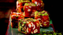 Delight in the exquisite taste of Sultan's Premium Turkish Delight - Orange Flavor with Hazelnut Covered Pistachio. Each sumptuous piece combines the tangy citrus notes of orange with the rich nuttiness of hazelnut, all enveloped in a crunchy pistachio coating. Elevate your Ramadan celebrations with this delightful treat, crafted with care and bursting with flavor. Order now for delivery in South Florida and across the US.  
