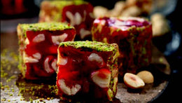 Indulge in the royal taste of Sultan's Premium Turkish Delight - Pomegranate Flavor with Hazelnut Covered Pistachio. Each luxurious piece is a harmonious blend of tangy pomegranate flavor and the nutty richness of hazelnut, perfectly complemented by the crunchy pistachio coating. Elevate your Ramadan celebrations with this exquisite delicacy, fit for royalty. Order now for delivery in South Florida and across the US.  