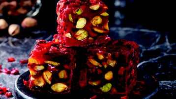 Indulge in the exquisite flavors of Sultan's Premium Turkish Delight - Pomegranate Flavor with Pistachio Covered Sour Raisin (Barberries). Each sumptuous piece offers a tantalizing blend of tangy pomegranate, crunchy pistachios, and zesty sour raisins, creating a symphony of taste sensations. Elevate your Ramadan celebrations with this luxurious delicacy, meticulously crafted to delight your senses. Order now for delivery in South Florida and across the US.  
